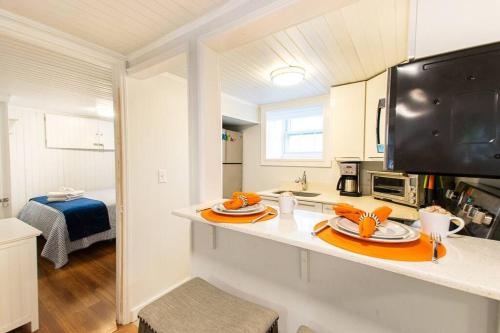 a kitchen with a counter with a plate of food on it at Condo with Wading Pool Dog Welcome in Provincetown