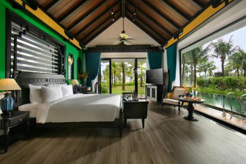 Krevet ili kreveti u jedinici u objektu Bliss Hoi An Beach Resort & Wellness