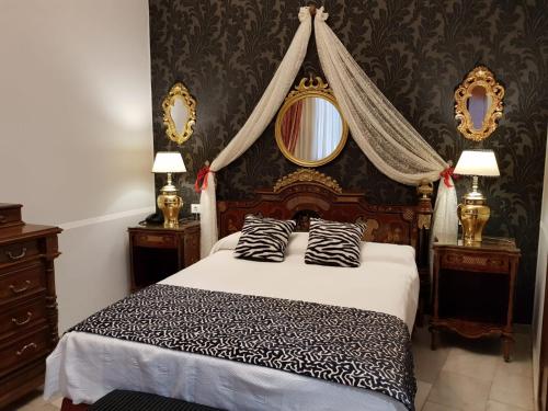 Cama ou camas em um quarto em Hotel Europa Boutique Sevilla