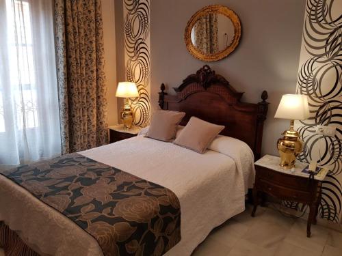 Cama ou camas em um quarto em Hotel Europa Boutique Sevilla