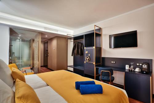 Giường trong phòng chung tại Design Plus Bex Hotel