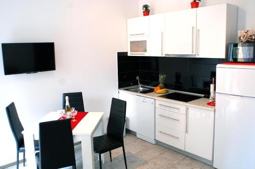 A kitchen or kitchenette at Apartment Citadela