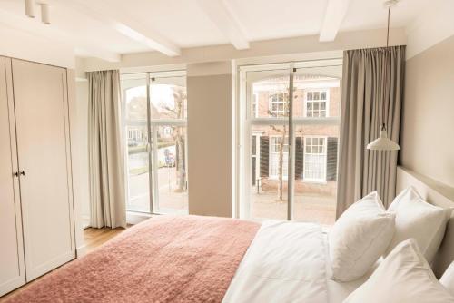 מיטה או מיטות בחדר ב-Boutique Hotel Weesp