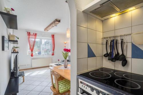 a kitchen with a stove and a counter top at Ferienwohnung Schläfer in Kappel-Grafenhausen