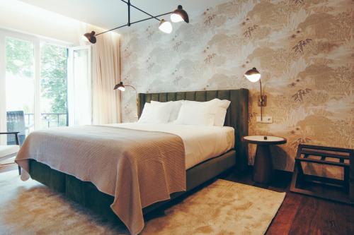 เตียงในห้องที่ Estalagem Santa Iria Hotel & Spa