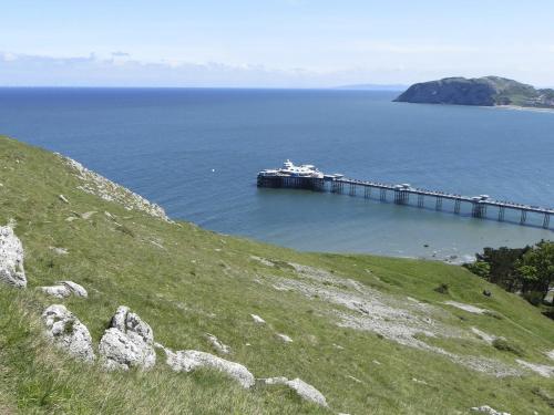 a pier in the middle of a large body of water at Seaclyffe Hotel Ltd in Llandudno