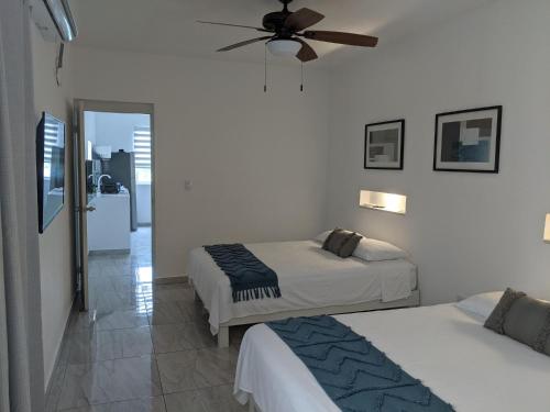 Hermoso departamento en Cancún YaxBahia 3 में एक कमरे में एक या कई बेड