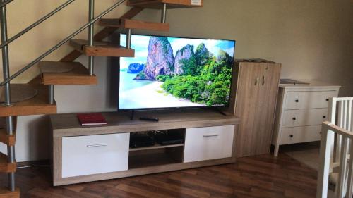 A television and/or entertainment centre at Lagom Apartman