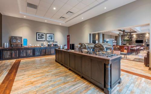 a large room with a salon with a counter at Hampton Inn Sydney in Sydney