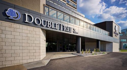 a building with a sign on the side of it at DoubleTree by Hilton Windsor, ON in Windsor