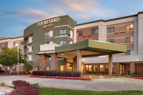 una rappresentazione della parte anteriore di un hotel di Courtyard by Marriott Houston NASA Clear Lake a Nassau Bay