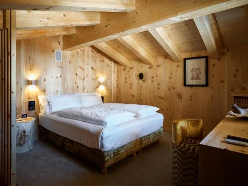 Ліжко або ліжка в номері Dolomiti Lodge Alverà