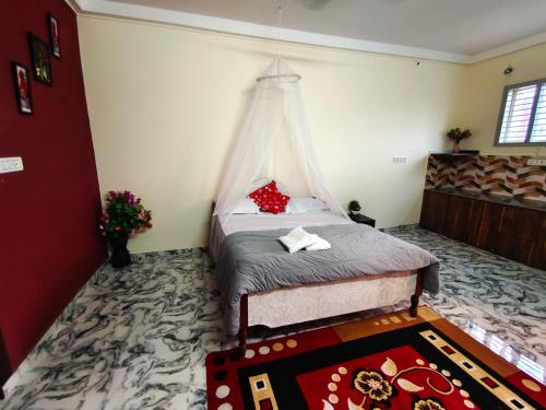 Katil atau katil-katil dalam bilik di Mannat Inn Homestay (Mysore)