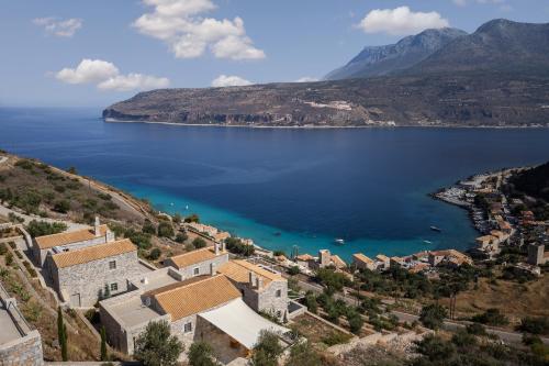 an aerial view of a town on the shore of a lake at Trapela Limeni Luxury Suites in Limeni