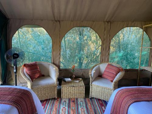 A seating area at Echoes of Eden: River Retreat