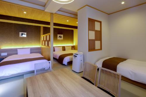 A bed or beds in a room at Dormy Inn Premium Ginza