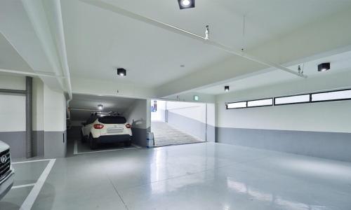 a parking garage with a car parked in it at Haeundae Dongbeck Hotel in Busan