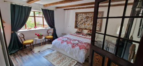 A bed or beds in a room at CasaGeo Cheile Nerei