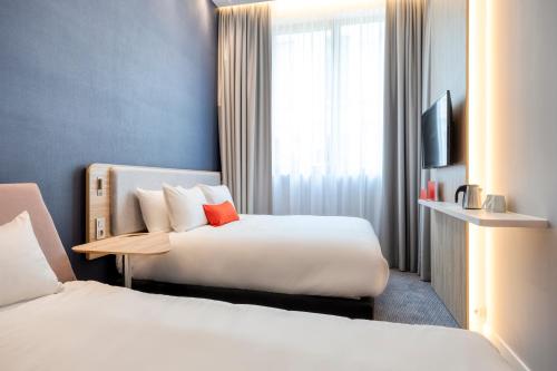 Katil atau katil-katil dalam bilik di Holiday Inn Express Antwerp - City Centre, an IHG Hotel