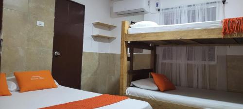 A bed or beds in a room at posada barrios mar