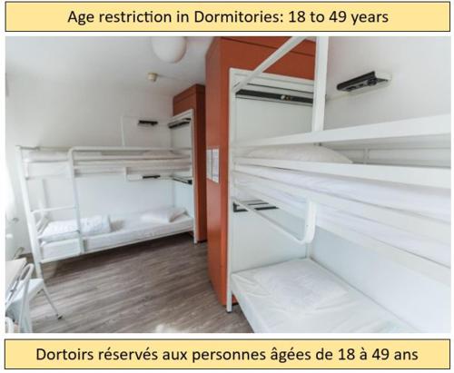 Cama ou camas em um quarto em City Hostel Geneva