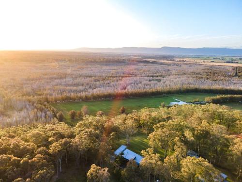 an aerial view of a lake in a forest at Springbank House in Jindy Andy