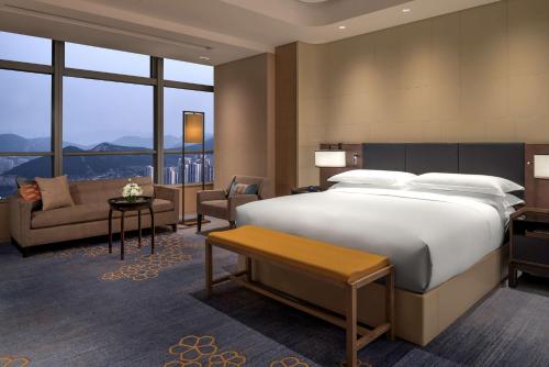 Krevet ili kreveti u jedinici u okviru objekta Hilton Jinan South Hotel & Residences