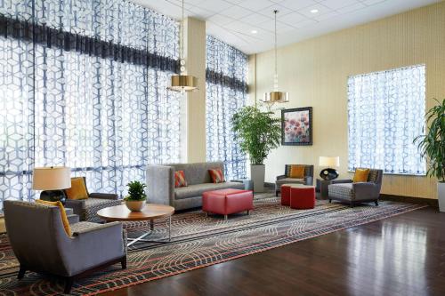 a lobby with couches and chairs and a table at Hampton Inn & Suites Mt. Prospect in Mount Prospect