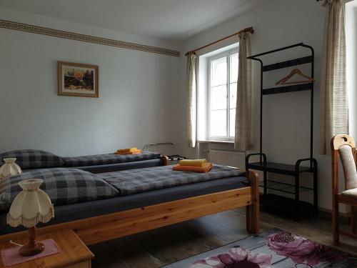 Kottmarschenke - Gästezimmer und Ferienwohnung am Kottmar房間的床