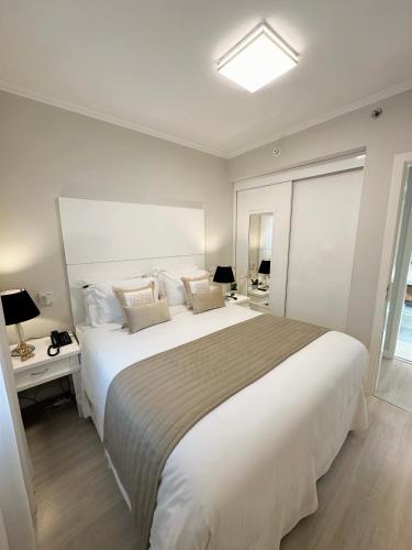 Tempat tidur dalam kamar di Sao Paulo Ibirapuera Privilege - Suite Deluxe