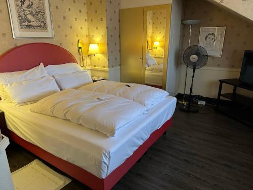 En eller flere senger på et rom på Boutique Hotel Belle Epoque