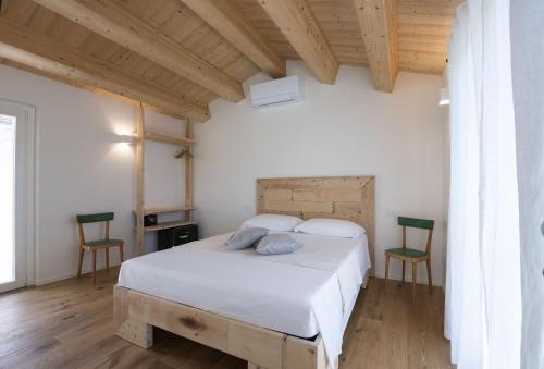 A bed or beds in a room at La casa del Sasso