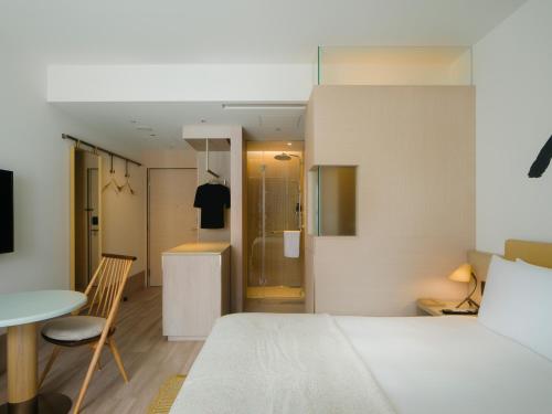 A bed or beds in a room at Zentis Osaka