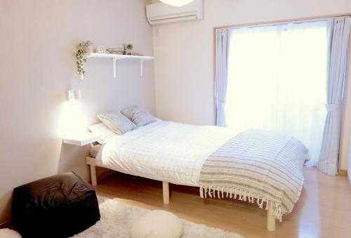 Cama ou camas em um quarto em Daiichi Mitsumi Corporation - Vacation STAY 15270