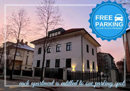 a building with the words free parking on top of it at Villa Riverside in Ljubljana