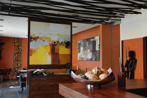 a dining room with a bowl of food on a table at Afrika Hotel Frýdek-Místek in Frýdek-Místek