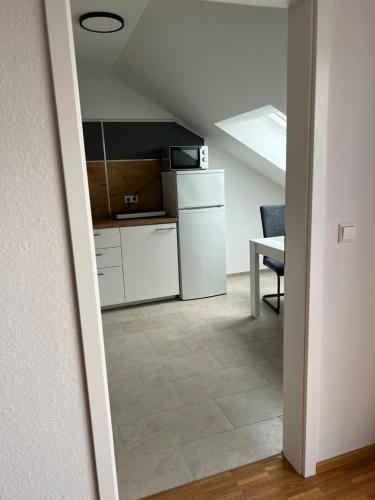 a kitchen with a sink and a counter at New Age Boardinghaus Bad Wimpfen in Bad Wimpfen