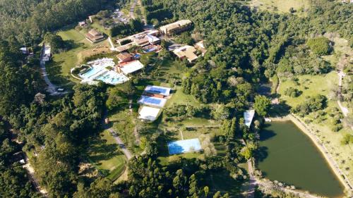 an aerial view of a house and a lake at Hotel Villa Rossa in São Roque