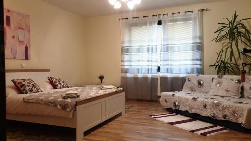 Кровать или кровати в номере Apartmán Beáta