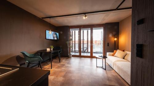 Una televisión o centro de entretenimiento en Stadthaus Neckarsulm serviced apartments - Stadthaus Heiner