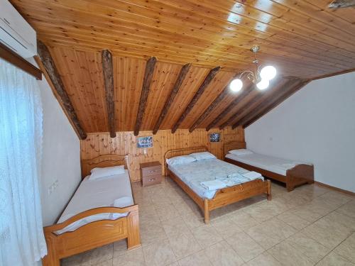 A bed or beds in a room at Guest House Argjiro Castle