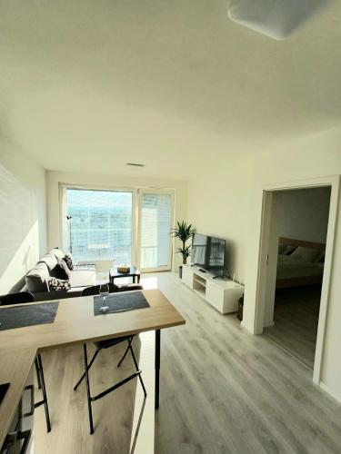 A television and/or entertainment centre at New apartment 5 minutes by walk from the airport with free garage parking