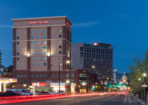 a building on a city street at night at Hampton Inn & Suites Boise-Downtown in Boise