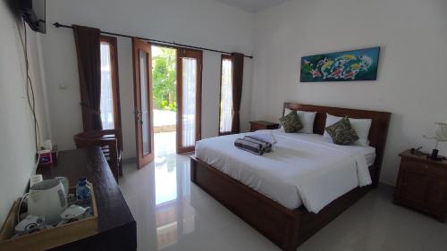 Cama ou camas em um quarto em Miko Bali Bungalow