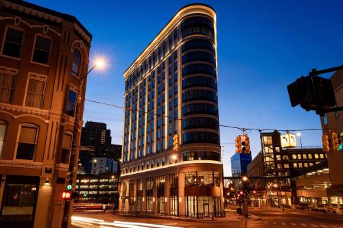 a tall building on a city street at night at Residence Inn by Marriott Grand Rapids Downtown in Grand Rapids