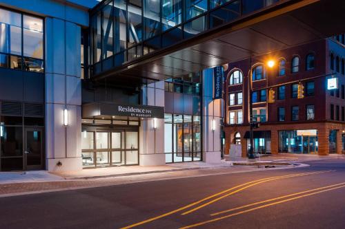 an empty street in front of a building at night at Residence Inn by Marriott Grand Rapids Downtown in Grand Rapids