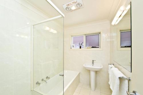 A bathroom at Beachside Haven - Your Perfect Oasis Home