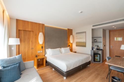 Krevet ili kreveti u jedinici u okviru objekta Hotel Boutique Mirlo Barcelona