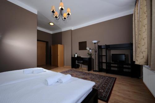 Ліжко або ліжка в номері Hotel Zlatá Štika