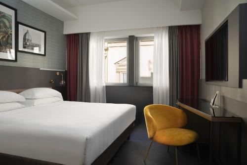 Cama ou camas em um quarto em iQ Hotel Firenze